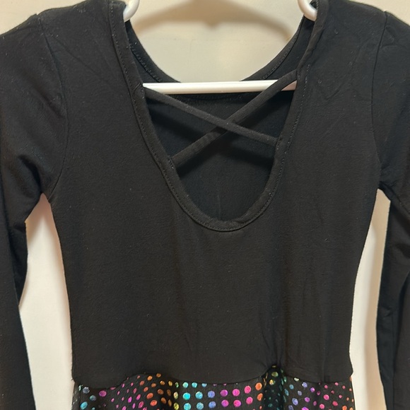 Pixie lane dress has black on top and flared rainbow sparkle on bottom. Size 2/3 - Picture 4 of 5